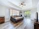 Bright living room with balcony access, stylish floors, and cozy seating area at 18001 Richmond Place Dr # 330, Tampa, FL 33647
