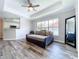 Sunlit living room showcasing hardwood floors and a stylish daybed at 18001 Richmond Place Dr # 330, Tampa, FL 33647