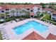 Beautiful swimming pool with surrounding lounge chairs and well-maintained landscaping at 18001 Richmond Place Dr # 330, Tampa, FL 33647