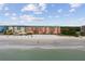 Beachfront condo buildings seen from the beach with blue skies and clear water at 18400 Gulf Blvd # 1105, Indian Shores, FL 33785