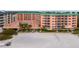 Beachfront view of the building, showing a large pool area at 18400 Gulf Blvd # 1105, Indian Shores, FL 33785