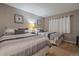 Comfortable bedroom showcasing two beds with neutral decor and natural light at 18400 Gulf Blvd # 1105, Indian Shores, FL 33785
