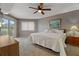 Comfortable bedroom with neutral tones, ceiling fan, and private balcony access at 18400 Gulf Blvd # 1105, Indian Shores, FL 33785