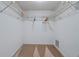 Empty walk-in closet with shelving and carpeting at 18400 Gulf Blvd # 1105, Indian Shores, FL 33785