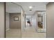 Tiled hallway with mirrored closet doors and access to other rooms at 18400 Gulf Blvd # 1105, Indian Shores, FL 33785