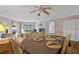 Spacious living area with dining table, fireplace, and access to outdoor balcony at 18400 Gulf Blvd # 1105, Indian Shores, FL 33785