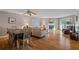 Inviting living and dining area with hardwood floors and a cozy fireplace at 18400 Gulf Blvd # 1105, Indian Shores, FL 33785