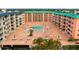 Elevated view of a resort-style pool area with plenty of seating at 18400 Gulf Blvd # 1105, Indian Shores, FL 33785