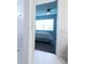 Ensuite bathroom view showing a tiled shower and a glimpse of the main bedroom beyond at 18933 Sailors Delight Pass, Land O Lakes, FL 34638