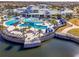 Aerial view of the community pool, clubhouse, and outdoor lounge areas at 18933 Sailors Delight Pass, Land O Lakes, FL 34638