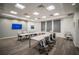 Modern conference room with U-shaped table, comfortable seating, TV, and professional ambiance at 18933 Sailors Delight Pass, Land O Lakes, FL 34638