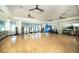 Bright fitness studio with hardwood floors, mirrors, and a variety of exercise equipment at 18933 Sailors Delight Pass, Land O Lakes, FL 34638
