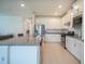 Modern kitchen with white cabinets, granite countertops, and stainless steel appliances at 18933 Sailors Delight Pass, Land O Lakes, FL 34638