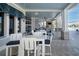 Covered outdoor dining area with comfortable seating, creating an inviting space for meals near the pool at 18933 Sailors Delight Pass, Land O Lakes, FL 34638