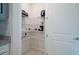 Walk-in pantry with white wire shelving, a tiled floor, and a white door at 18933 Sailors Delight Pass, Land O Lakes, FL 34638