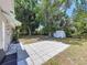 Spacious backyard with a patio, mature trees, and a storage shed at 2152 74Th N St, St Petersburg, FL 33710