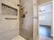 Modern bathroom with tiled shower featuring a built-in niche and updated fixtures at 2152 74Th N St, St Petersburg, FL 33710