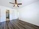 Bright bedroom featuring wood floors, white walls, and access to an ensuite bathroom at 2152 74Th N St, St Petersburg, FL 33710