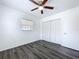 Bright bedroom with a ceiling fan, closet and window overlooking the outdoors at 2152 74Th N St, St Petersburg, FL 33710
