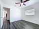 Bedroom featuring a ceiling fan, closet and a window overlooking the outdoors at 2152 74Th N St, St Petersburg, FL 33710