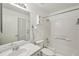 This bathroom features a shower, vanity, mirror, and a toilet with a towel rack at 2436 Nantucket Harbor Loop # 104, Sun City Center, FL 33573