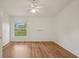 Bright and airy bedroom featuring hardwood floors and a window view at 2436 Nantucket Harbor Loop # 104, Sun City Center, FL 33573