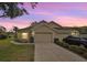 Charming single-story home with well-manicured lawn and a two-car garage in a residential neighborhood at 2436 Nantucket Harbor Loop # 104, Sun City Center, FL 33573