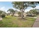 This home boasts manicured landscaping, large trees and a two car garage with an extended driveway at 2436 Nantucket Harbor Loop # 104, Sun City Center, FL 33573