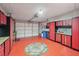 This garage features storage cabinets, a rubber floor, and an automatic door opener at 2436 Nantucket Harbor Loop # 104, Sun City Center, FL 33573