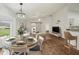 Inviting living space with barn door, dining area and an open layout offering seamless flow and natural light at 2436 Nantucket Harbor Loop # 104, Sun City Center, FL 33573