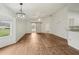 Inviting living space with barn door, dining area and an open layout offering seamless flow at 2436 Nantucket Harbor Loop # 104, Sun City Center, FL 33573