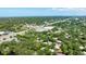 Expansive aerial view showing a large community with mature trees and a picturesque waterfront location at 2626 2Nd Ct, Palm Harbor, FL 34684