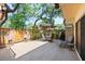 Backyard view showing outdoor table, seating area, and a grill at 2626 2Nd Ct, Palm Harbor, FL 34684