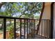 Balcony view overlooking green space and neighboring units at 2626 2Nd Ct, Palm Harbor, FL 34684