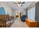 This bedroom has unique mountain themed wallpaper, a ceiling fan, and mirrored closets at 2626 2Nd Ct, Palm Harbor, FL 34684