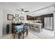 Eat-in kitchen with dark wood cabinets, stainless steel appliances, and a ceiling fan at 2626 2Nd Ct, Palm Harbor, FL 34684