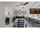 Dining room with table, barstool seating, and dark wood cabinets at 2626 2Nd Ct, Palm Harbor, FL 34684