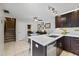 Bright, updated kitchen featuring modern lighting and adjacent dining space at 2626 2Nd Ct, Palm Harbor, FL 34684
