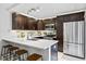 Well-appointed kitchen with stainless appliances and counter seating at 2626 2Nd Ct, Palm Harbor, FL 34684
