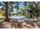 Scenic view of a lake with trees and a fountain at 2626 2Nd Ct, Palm Harbor, FL 34684