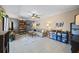 Bright and airy living room with tile floors, ceiling fan, and a comfortable couch at 2626 2Nd Ct, Palm Harbor, FL 34684