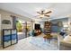 Open living room featuring neutral tones and access to the back patio at 2626 2Nd Ct, Palm Harbor, FL 34684