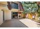 Private outdoor patio with grill, dartboard, and fence at 2626 2Nd Ct, Palm Harbor, FL 34684