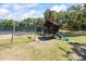 Community playground with swingset and slide at 2626 2Nd Ct, Palm Harbor, FL 34684