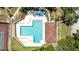 Aerial view of community pool, hot tub, and lounge area at 2626 2Nd Ct, Palm Harbor, FL 34684