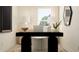 Modern home office with sleek black desk and minimalist décor at 2685 Buttercup Lucine Ln, Ruskin, FL 33570
