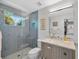 Updated bathroom features a tiled shower with glass door and vanity with marble countertop at 2802 Northpointe Ln, Tampa, FL 33611