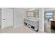 Well-lit bathroom with a double vanity, ample storage, and views to the water at 2802 Northpointe Ln, Tampa, FL 33611