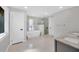 Modern bathroom with a standalone tub, a glass-enclosed shower, and a double vanity at 2802 Northpointe Ln, Tampa, FL 33611