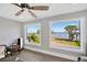 Bright bedroom showcasing serene water views through large windows at 2802 Northpointe Ln, Tampa, FL 33611
